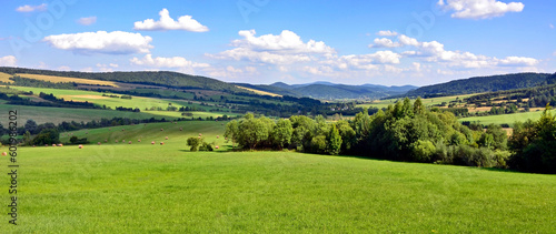 Panoramic view of Low Beskids (Beskid Niski) mountain range from the nearby slopes. Low Beskids is part of Carpathian mountains in Poland.