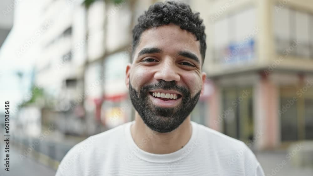 Young hispanic man smiling confident speaking at street Young hispanic man smiling confident speaking at street