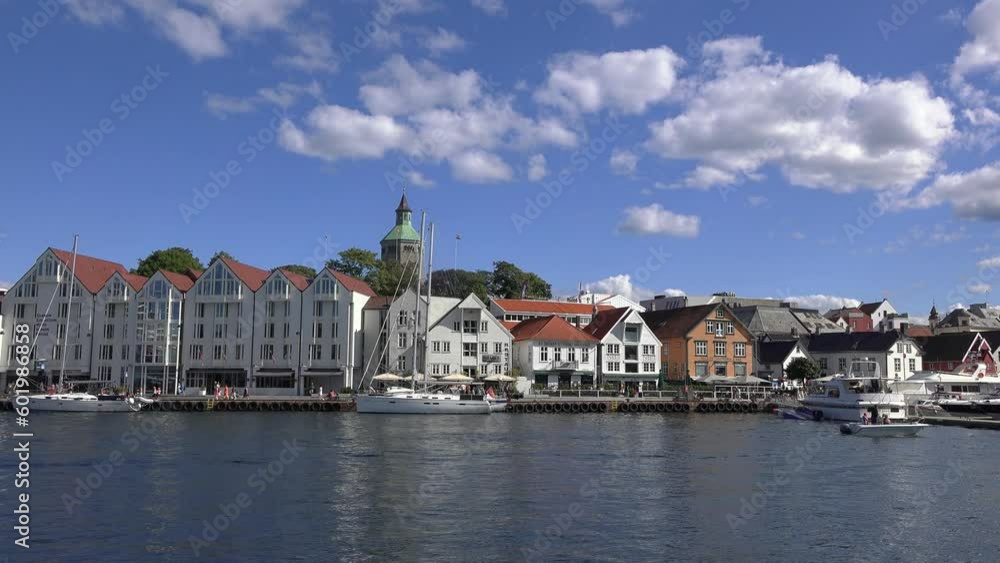 Panorama of the Norwegian city of Stavanger on a sunny summer day. Establishing shot. View of the city center with many shops and restaurants. Spectacular multicolor wooden houses view. Panorama of the Norwegian city of Stavanger on a sunny summer day. Establishing shot. View of the city center with many shops and restaurants. Spectacular multicolor wooden houses view.