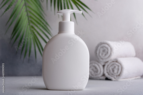 White blank packaging cosmetic plastic bottle with palm leaves © viktoriya89
