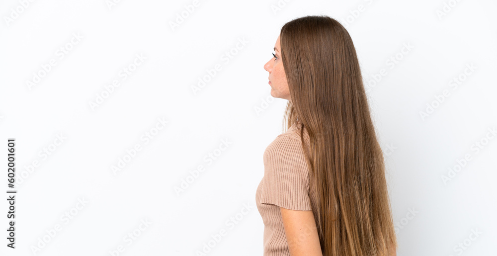 Young Lithuanian woman isolated on white background in back position and looking back Young Lithuanian woman isolated on white background in back position and looking back