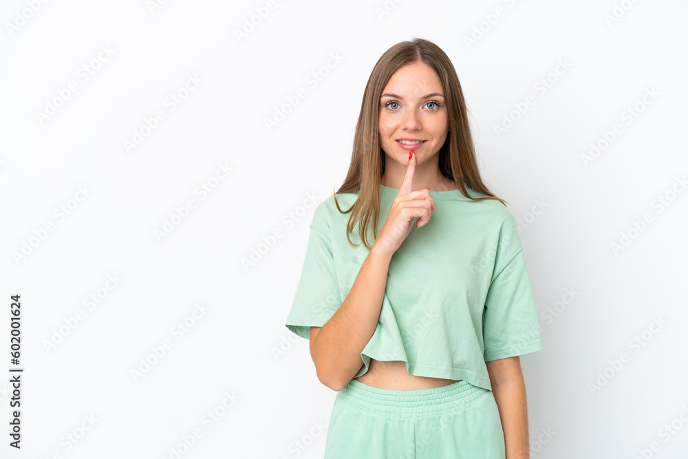 Young Lithuanian woman isolated on white background showing a sign of silence gesture putting finger in mouth Young Lithuanian woman isolated on white background showing a sign of silence gesture putting finger in mouth