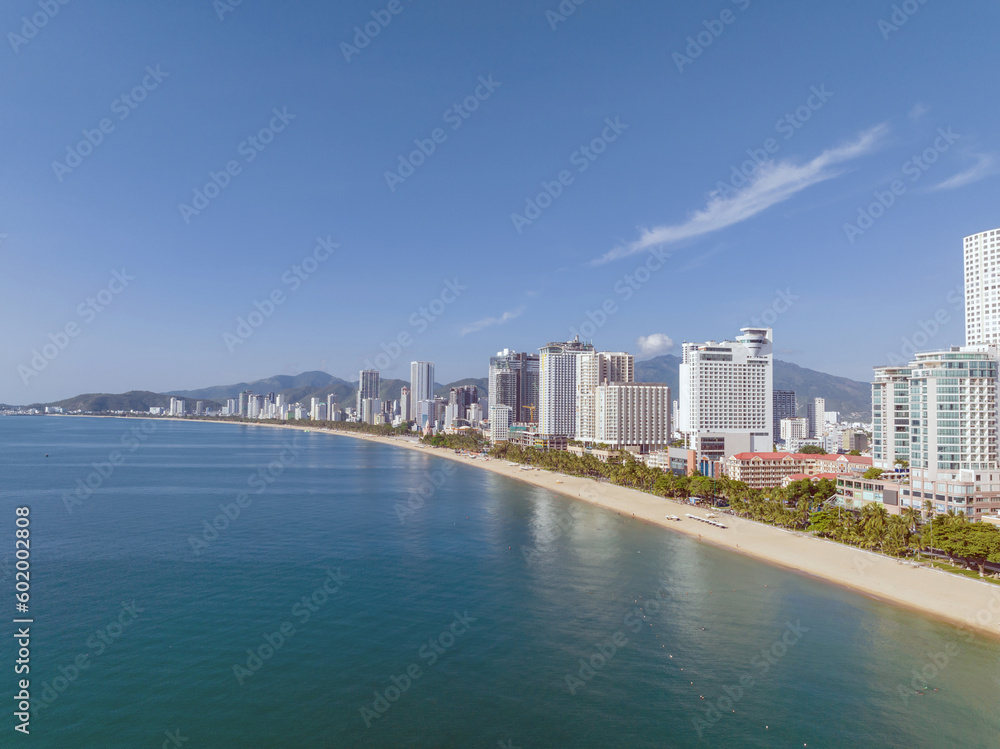 Obraz premium Nha Trang landscape with beach and high-rise buildings, famous vacation destination in Khanh Hoa, Vietnam