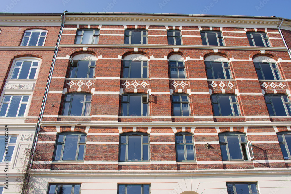 Facade of a apartment building iwith windows the center of Copenhagen in Denmark