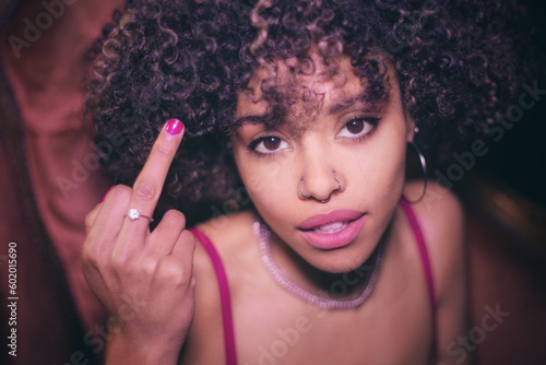 Afro-haired young woman flirting with the camera