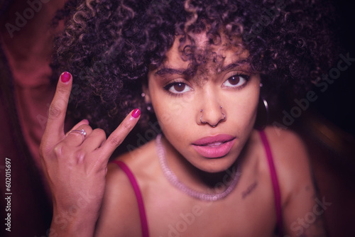 Afro-haired young woman flirting with the camera (1/3)