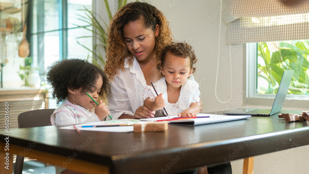 African American mother playing with her daughters in home African American mother playing with her daughters in home