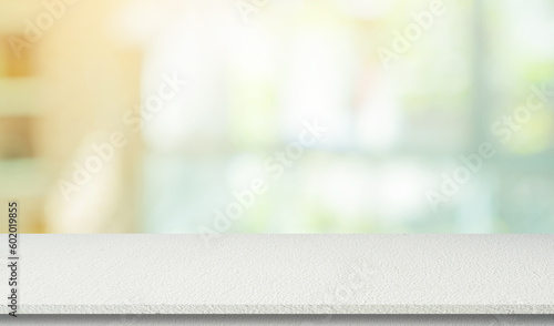 blur modern garden outdoor background with glow sunny light and plain concrete table top perspective view for promote product concept