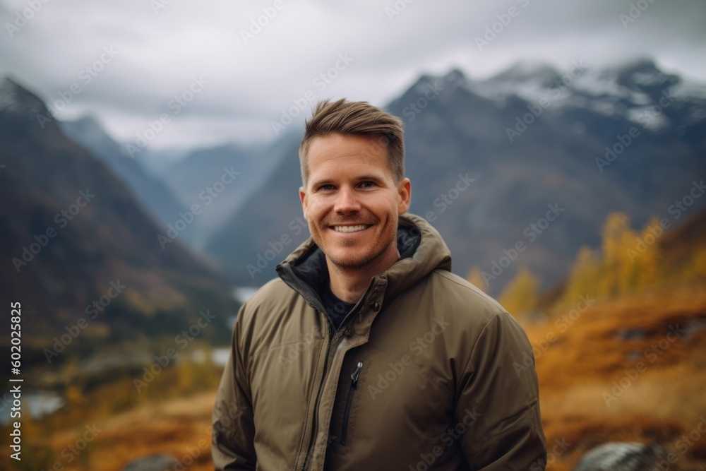 Handsome man hiking in the mountains. Outdoor lifestyle portrait.