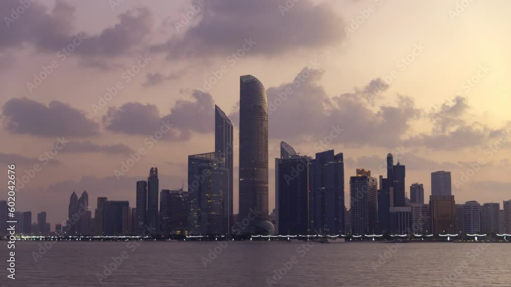 Abu Dhabi, UAE-Jan, 10 2019: Sunrise time lapse of high rise building of hotel, offices in Abu Dhabi capital, United Arab Emirates Abu Dhabi, UAE-Jan, 10 2019: Sunrise time lapse of high rise building of hotel, offices in Abu Dhabi capital, United Arab Emirates