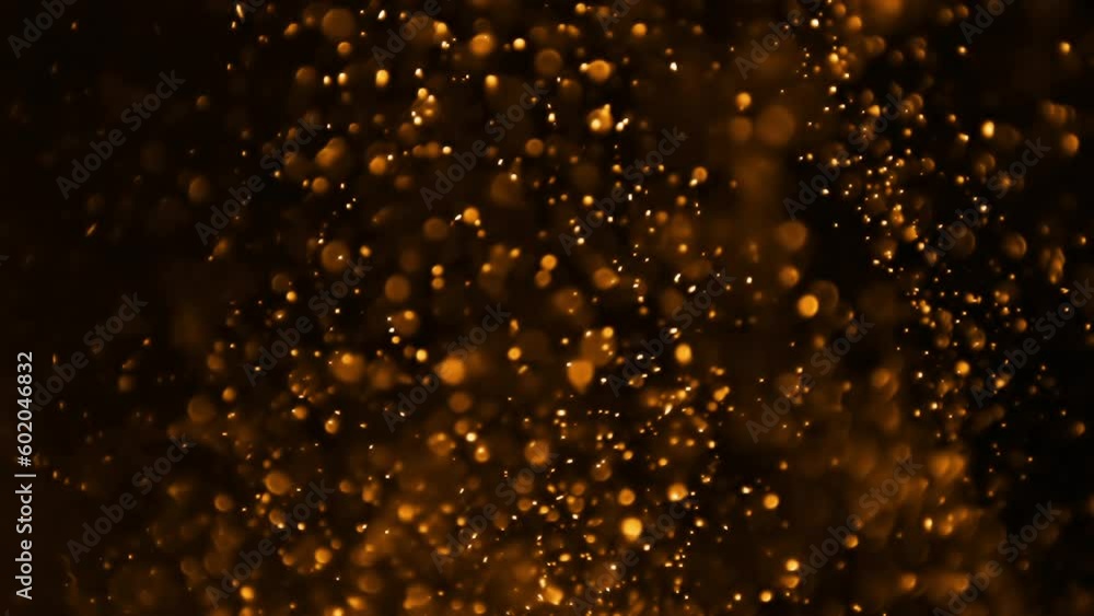 Glowing Orange Particles With Bokeh On Black Background Glowing Orange Particles With Bokeh On Black Background