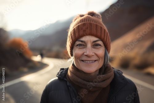 Portrait Of Mature Woman Wearing Winter Hat On Country Road © Robert MEYNER