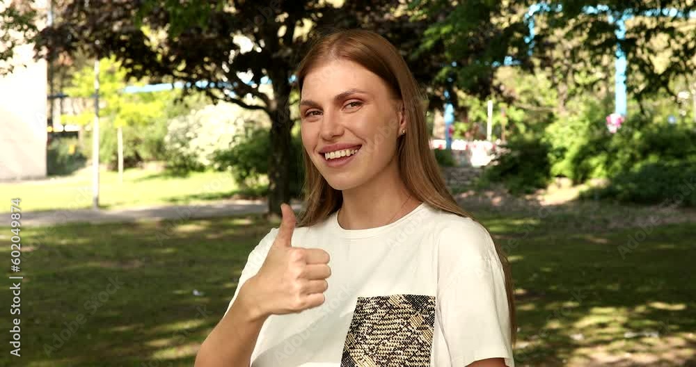 Thumbs Up By Excited Woman Outdoor. Thumbs Up By Excited Woman Outdoor.