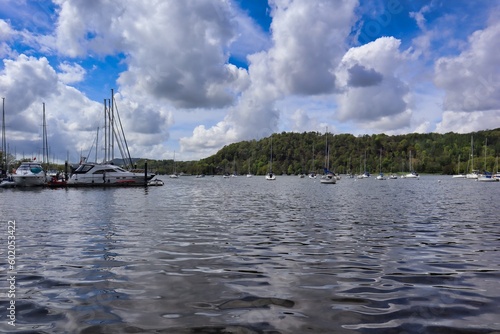 yatchs and boats reflection on bowness on winderemere lake in the Lake District photo