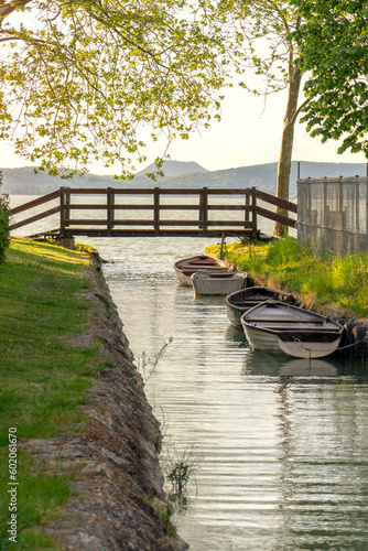 nice bridge with a small canal in Balatonbolar and fishng boats next to Lake Balaton
