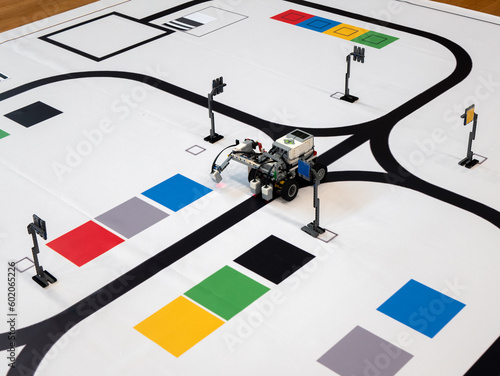Line Following Robot is doing task to move from one point to another on the mat. Programmable robots