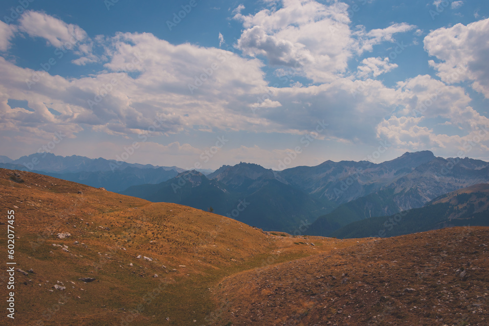 Fototapeta premium A picturesque landscape of a hiking path in the Alps in the Queyras valley (Hautes-Alpes, France)