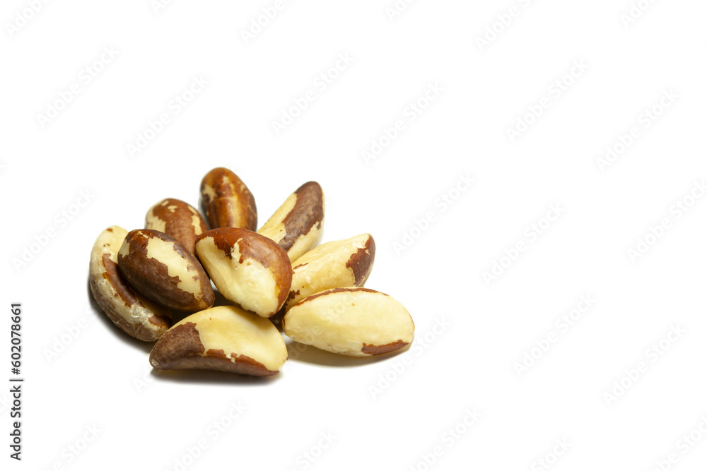 Several brazil nuts on a white background. Isolated.