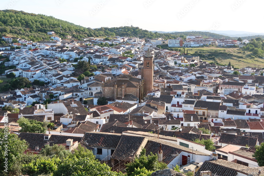 Cortegana, Huelva, Spain, May 12, 2023: White houses of the Andalusian magical town of Cortegana, Huelva, Spain with the Divino Salvador church in the center
