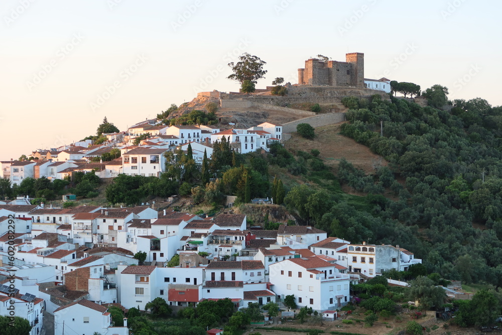 Cortegana, Huelva, Spain, May 12, 2023: View of the white houses and the castle of the magical Andalusian town of Cortegana, Huelva, Spain