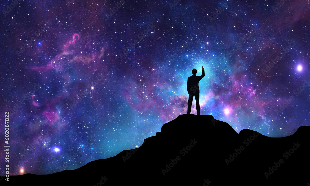 Business man Looking at the milky way and touching the night sky full of stars and dreamful universe Light. Businessman Surreal dreams and imagination concept 