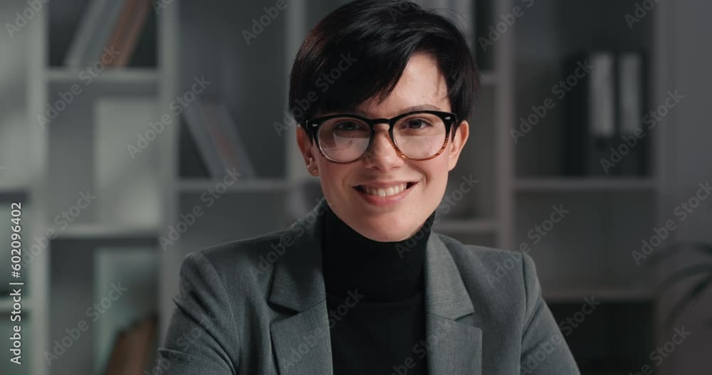 Portrait of a gorgeous girl in gray suit looking at camera and smiling. Portrait of a gorgeous girl in gray suit looking at camera and smiling.