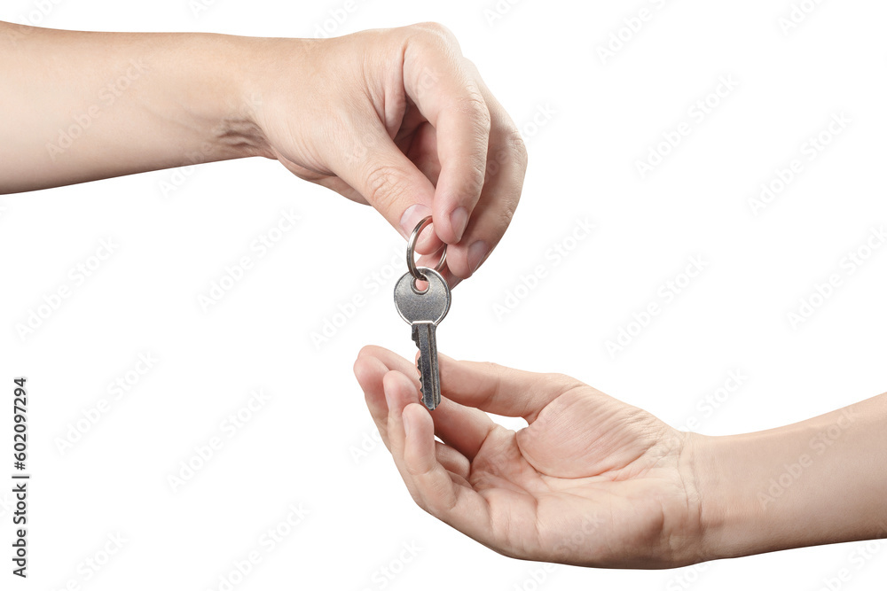 Foto de Two hands sharing a house key, cut out do Stock Adobe Stock