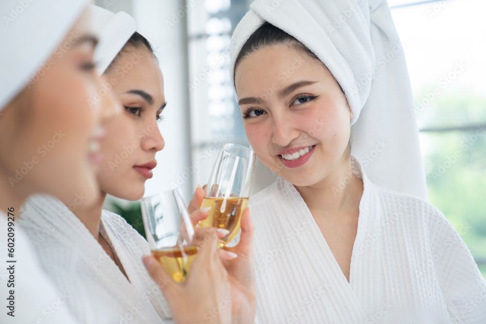 asian female wear white bathrobe and drink wine asian female wear white bathrobe and drink wine