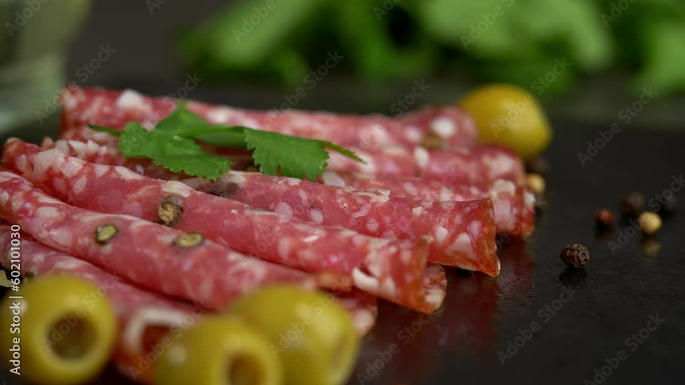 Fresh slices smoked sausage with spices and seasonings on cutting board. Cold cuts. Meat Fresh slices smoked sausage with spices and seasonings on cutting board. Cold cuts. Meat