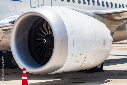 close-up on the wing of a passenger aircraft with a turbine at the airport in thailand. travel and cargo transportation.