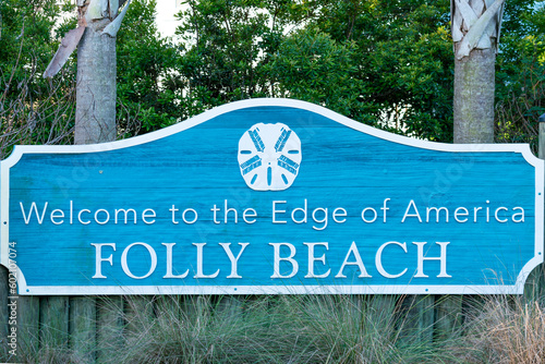 Welcome sign for Folly Beach located on Folly Island in Charleston County in South Carolina.  Folly Beach is called the edge of America and known for its breathtaking views.  