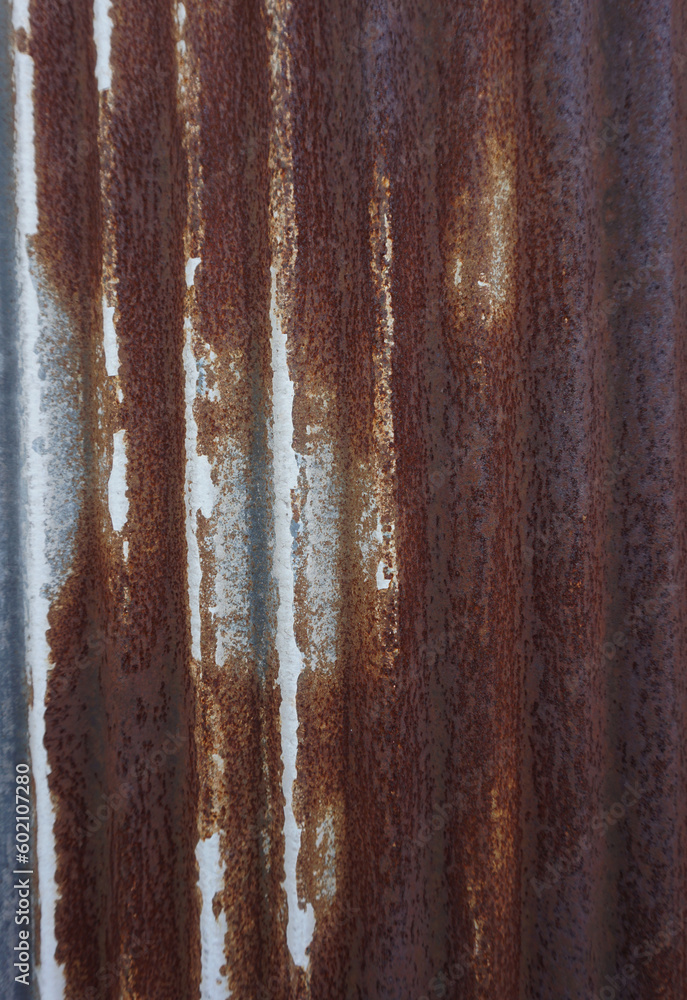 The texture of an old and rusted green steel plate is used as a design background The texture of an old and rusted green steel plate is used as a design background
