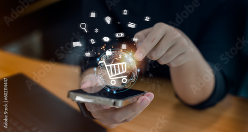 Shoppers use mobile to input orders with credit card delivery for online shopping and e-commerce technology concepts.