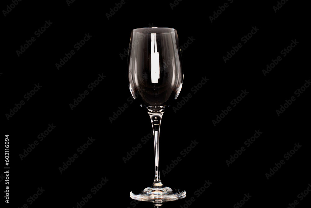 One crystal wine glass, macro, isolated on black background. One crystal wine glass, macro, isolated on black background.