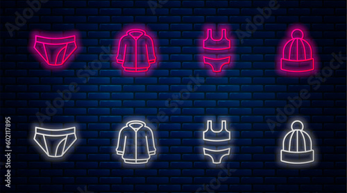 Set line Hoodie, Swimsuit, Men underpants and Winter hat. Glowing neon icon on brick wall. Vector