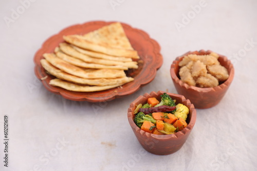 desi breakfast mixed vegetables, Halwa and paratha served in dish isolated on background top view of bangladesi breakfast photo