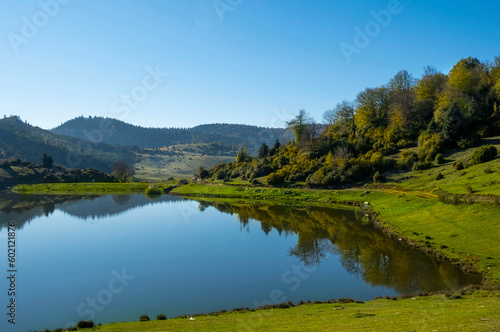 Landscape of lake and forest in Sultanpinar Plateau in Bolu Turkey with reflection blue sky autumn