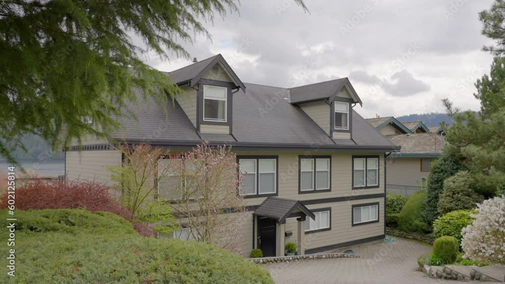 Establishing shot of modern apartment building with beautiful spring blossom landscape in Vancouver, Canada, North America. Day time on April 2023. ProRes 422 HQ. Establishing shot of modern apartment building with beautiful spring blossom landscape in Vancouver, Canada, North America. Day time on April 2023. ProRes 422 HQ.