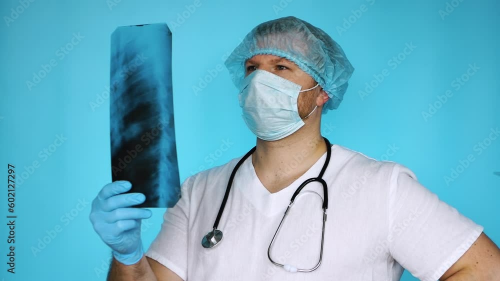 The surgeon diagnoses the ultrasound of the human ribs. The doctor in