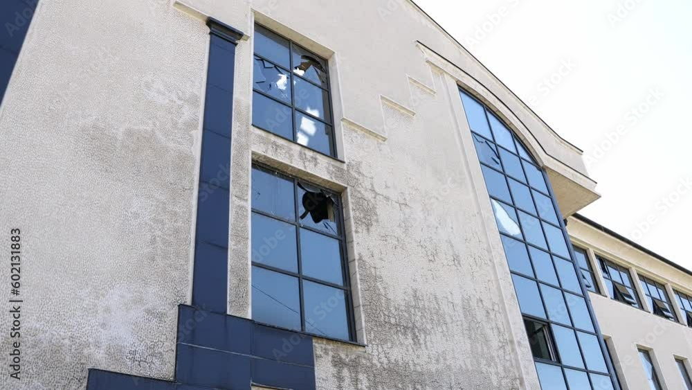 Shelled building with broken windows, beaten walls. War. Shelled building with broken windows, beaten walls. War.