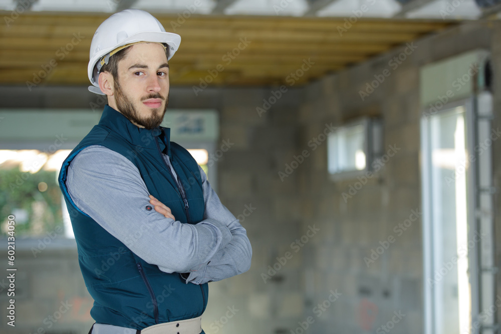 engineer in white hardhat standing on construction site engineer in white hardhat standing on construction site