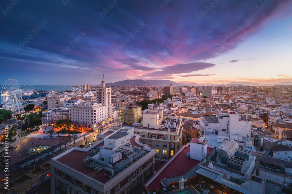 Fototapeta premium Aerial view of Malaga at sunset with La Equitativa Building - Malaga, Andalusia, Spain