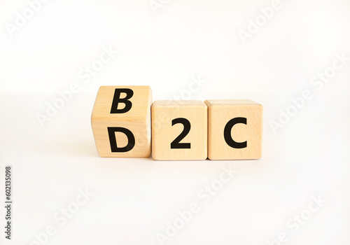 B2C or D2C symbol. Concept words B2C business to consumer D2C direct to consumer. Beautiful white table white background. B2C business to consumer D2C direct to consumer concept. Copy space.