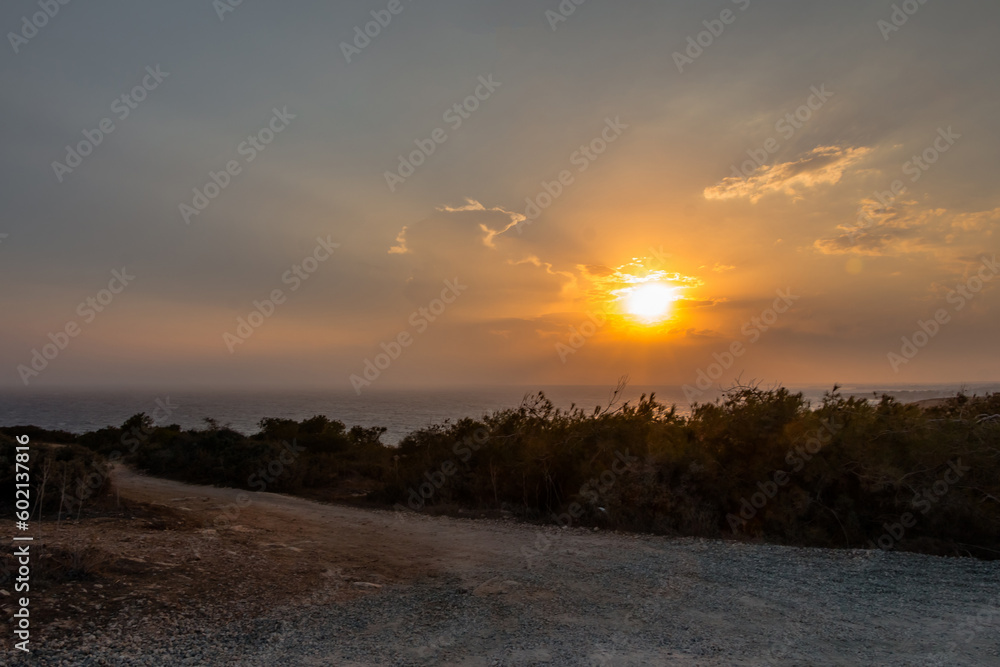 View of the sunset and the sea from cape greco on the island of cyprus