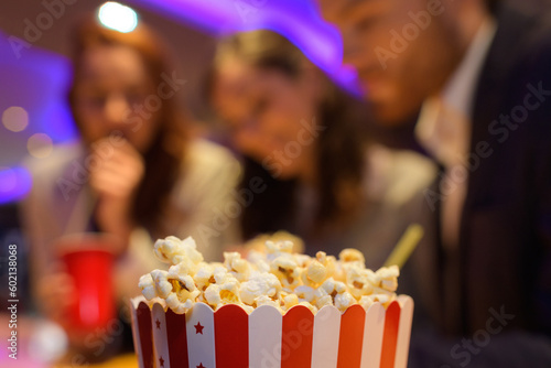 holding a large bowl of popcorn