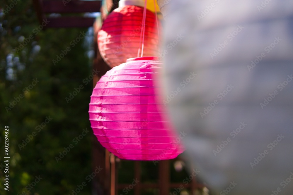 Solar pink colored solar lanterns in the home terrace
