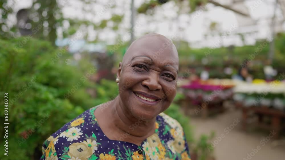 Portrait of a Brazilian older woman close-up face looking at camera standing inside a Green Environment Portrait of a Brazilian older woman close-up face looking at camera standing inside a Green Environment