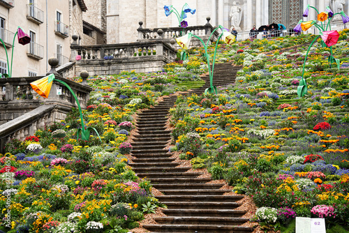 Church ancient stone stairs decorated with flowers in Historic center, spring festival flower, temps de flors 2023. Flower time photo