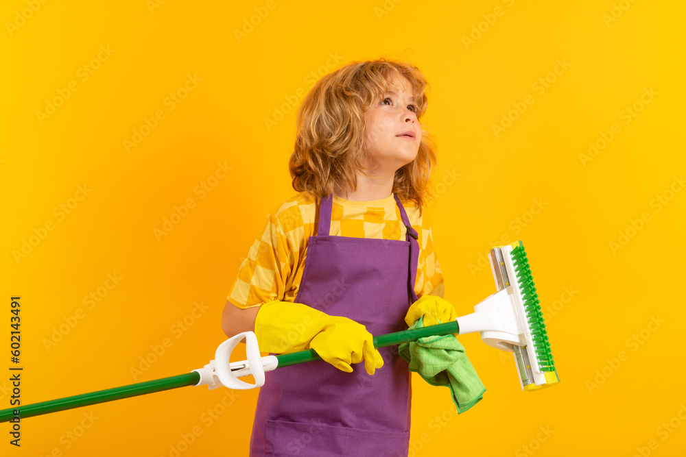 Portrait of child cleaning, concept growth, development, family relationships. Housekeeping and home cleaning concept. Child use duster and gloves for cleaning. Studio isolated background.