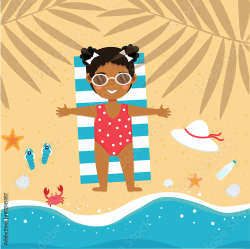 Little african american girl is lying on the beach and sunbathing on towel in the shade of palm trees on the beach. Cute little girl on vacation. Summer time, holiday.